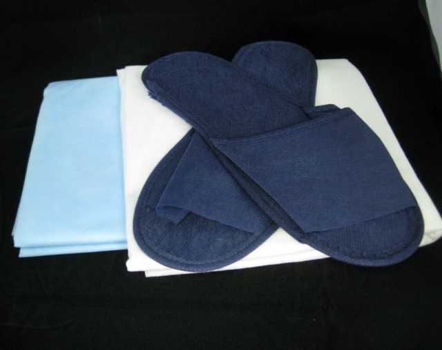 Продам: Одноразовые тапочки, простыни, полотенца