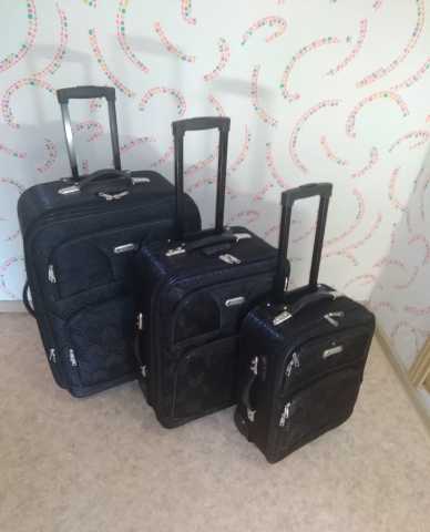 Продам: Новые чемоданы черные